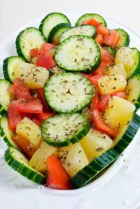 Salad with cucumbers, tomatoes and potatoes